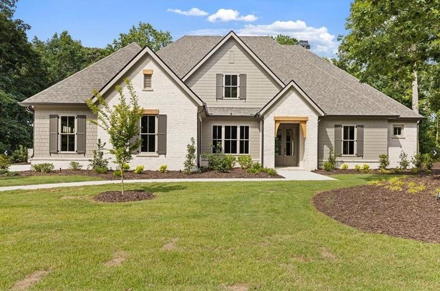Front exterior of a new home in , Cumming, GA, highlighting curb appeal (Image 2). Front exterior of a new home in , Cumming, GA, highlighting curb appeal (Image 2).