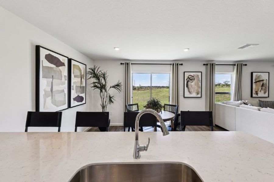 A kitchen with a large window. A kitchen with a large window.