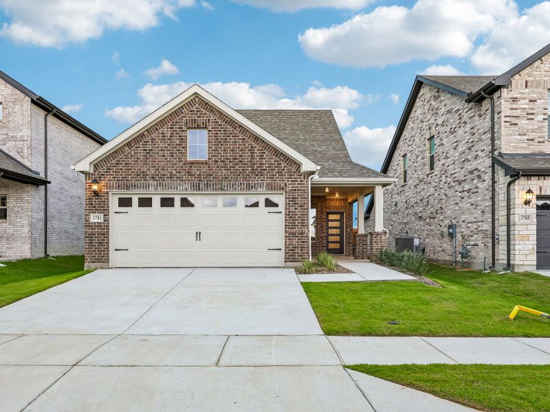 Front exterior of a new home in Parks at Foster Crossing - Spring Series, Anna, TX, highlighting curb appeal (Image 1). Front exterior of a new home in Parks at Foster Crossing - Spring Series, Anna, TX, highlighting curb appeal (Image 1).