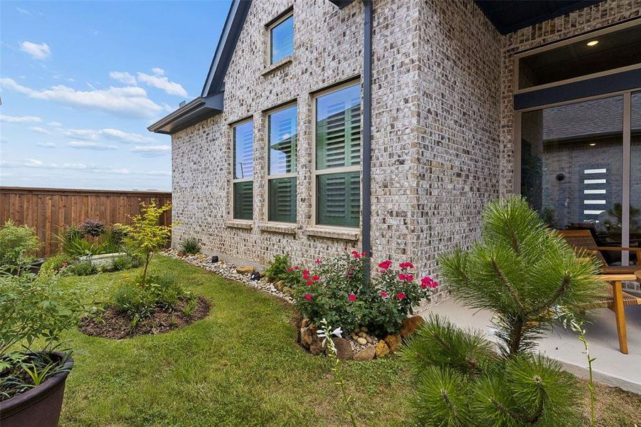 Exterior details and patio area of a home in Elements at Viridian - Garden Series, Arlington (Image 29).