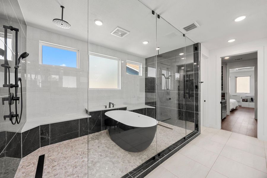 Dual showers with soaking tub.