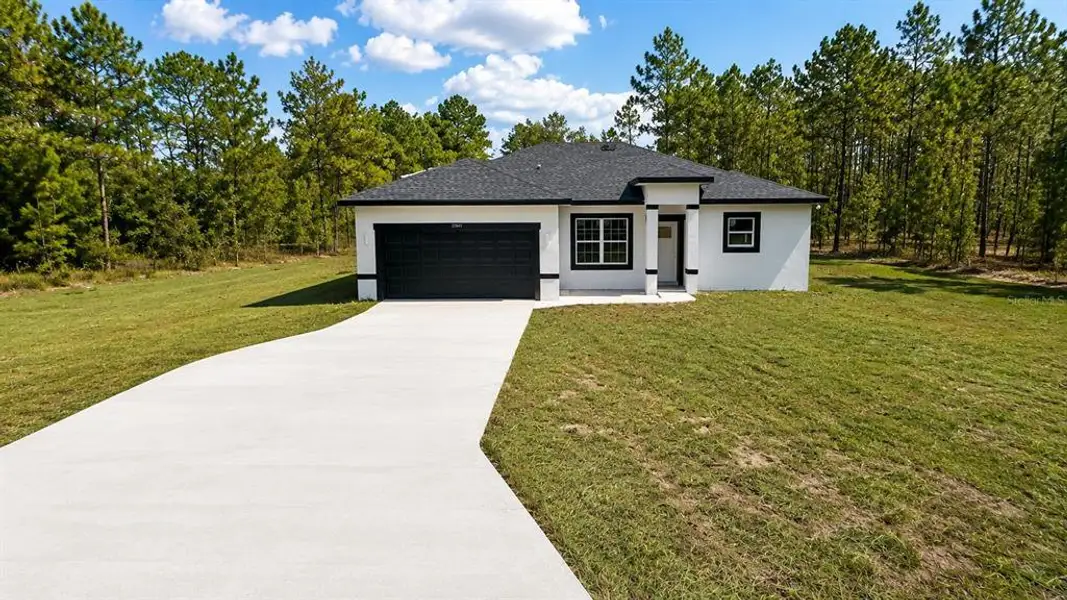 Front exterior of a new home in , Dunnellon, FL, highlighting curb appeal (Image 1). Front exterior of a new home in , Dunnellon, FL, highlighting curb appeal (Image 1).