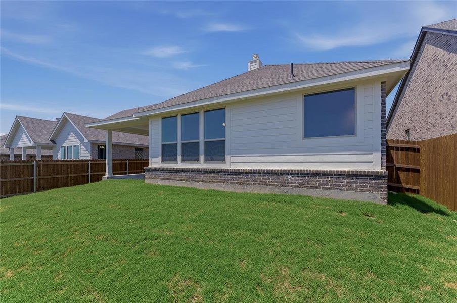 Manicured lawn with a privacy fence Manicured lawn with a privacy fence