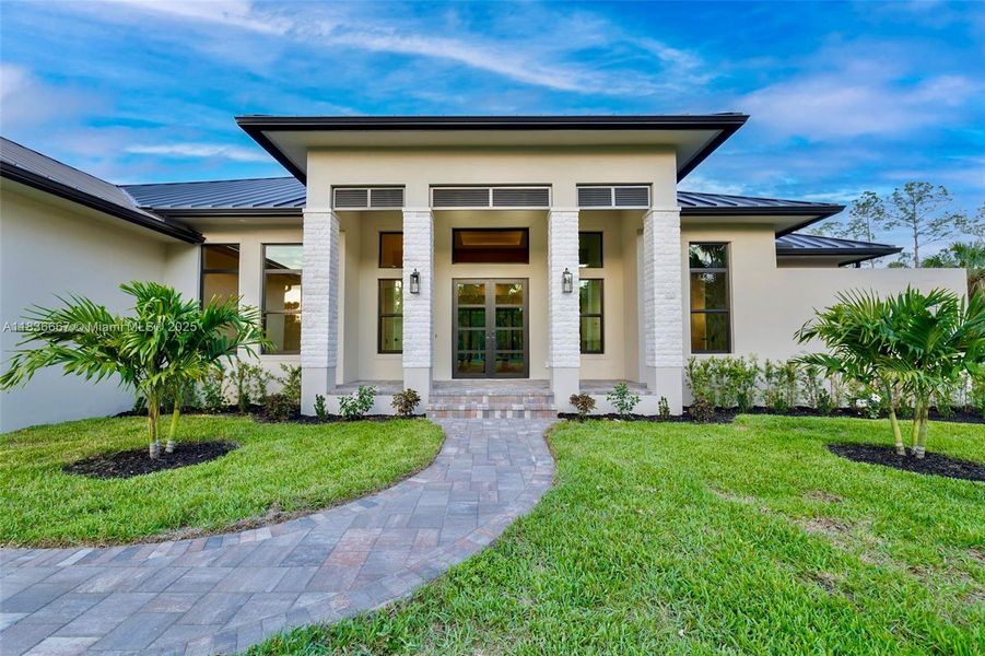 Front exterior of a new home in , Naples, FL, highlighting curb appeal (Image 22).