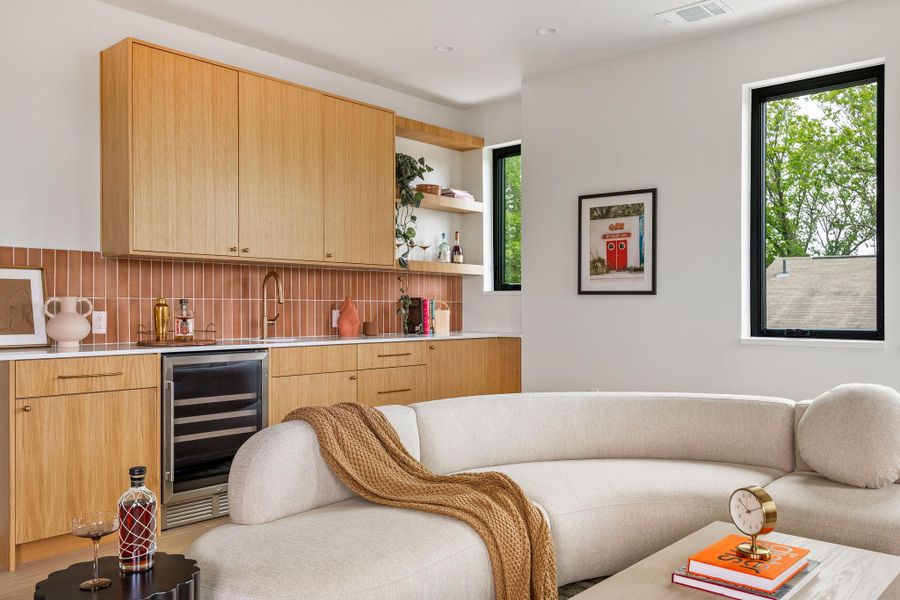 Living room with wine cooler, wet bar, and recessed lighting Living room with wine cooler, wet bar, and recessed lighting