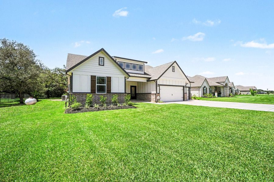 Front exterior of a new home in , Bay City, TX, highlighting curb appeal (Image 22).