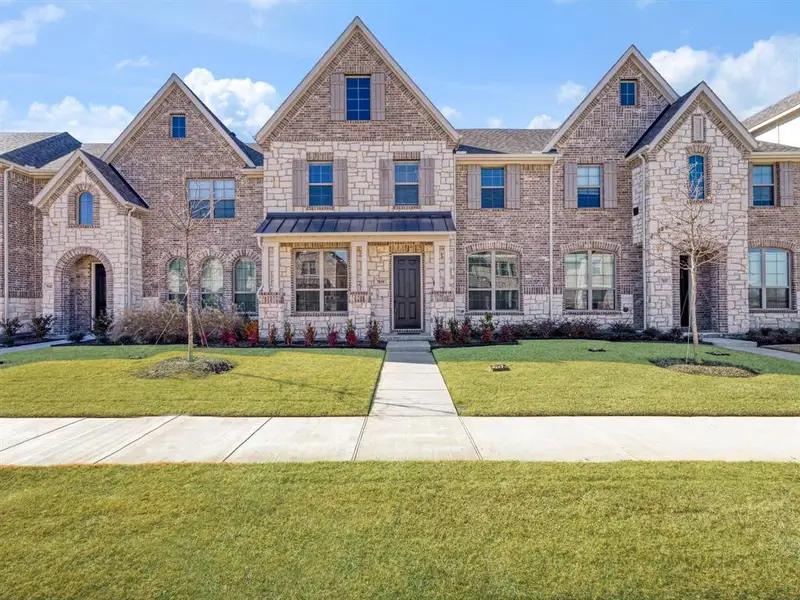 Front exterior of a new home in , Grand Prairie, TX, highlighting curb appeal (Image 24).