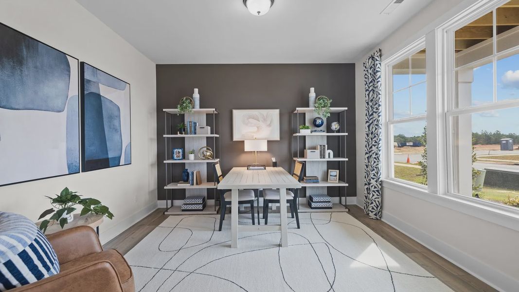 Flexible multi-use study with large windows and elevated ceiling in the Jordan Design by DRB Homes in York, SC
