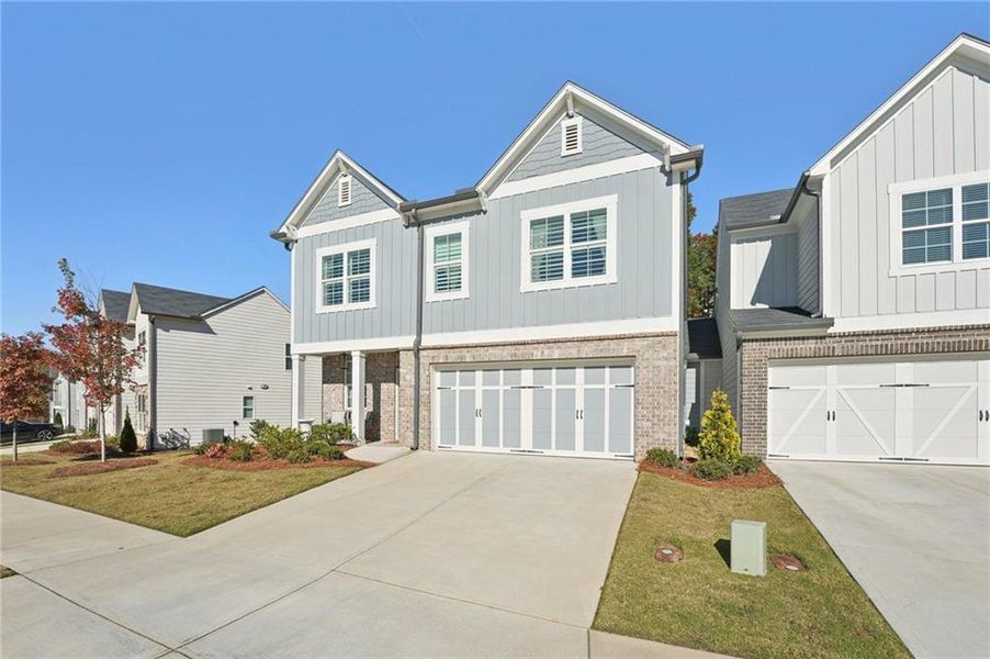 Front exterior of a new home in , Canton, GA, highlighting curb appeal (Image 2).