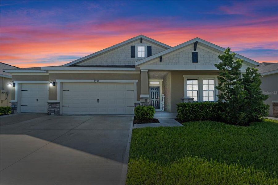 Front exterior of a new home in , Harmony, FL, highlighting curb appeal (Image 21).