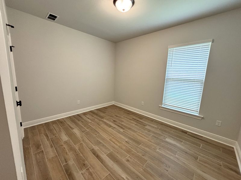 Spacious, unfurnished interior of a new home in Bird Song at Hammock Bay, Freeport (Image 26).