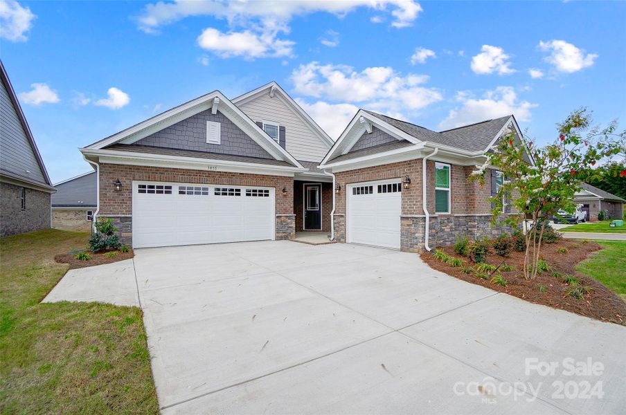 Front View of Home with Third Car Carriage Garage