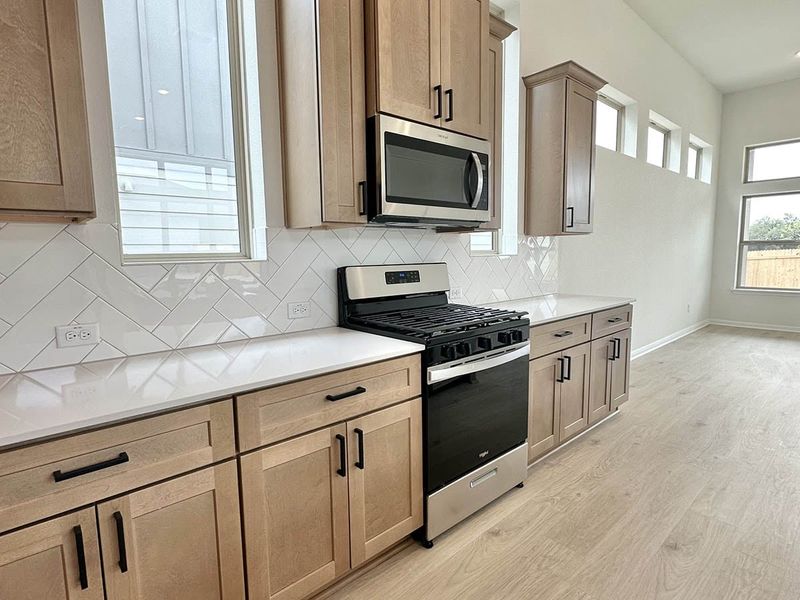Furnished interior view inside a new home in Sage Hollow, Kyle (Image 9).