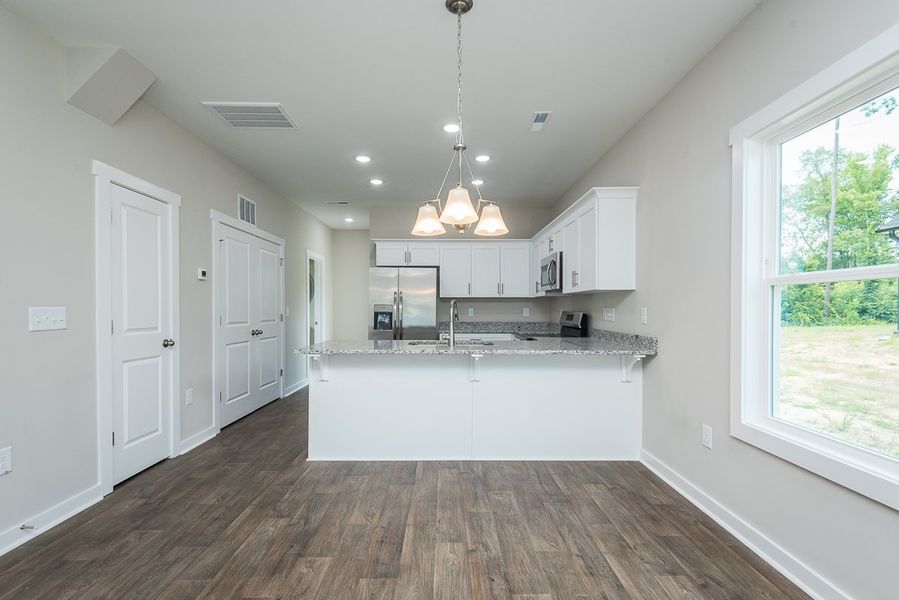 Representative furnished interior of a home built from the Jefferson (FP) by Foundation Home Builders LLC in Pinnix Loop, Burlington (Image 4).