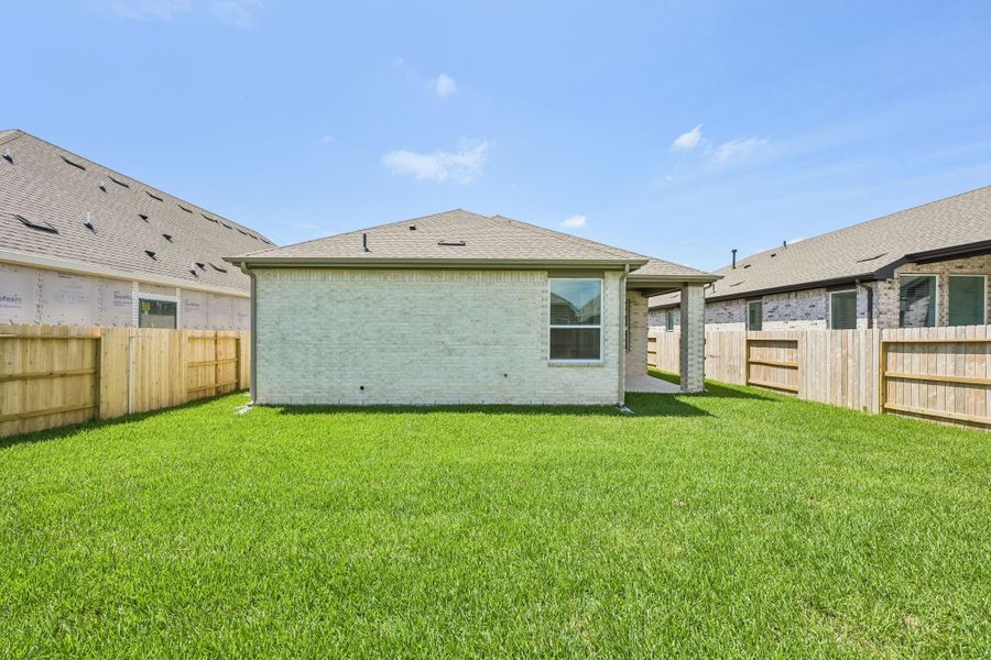 Exterior details and patio area of a home in Wood Leaf Reserve, Tomball (Image 18). Exterior details and patio area of a home in Wood Leaf Reserve, Tomball (Image 18).