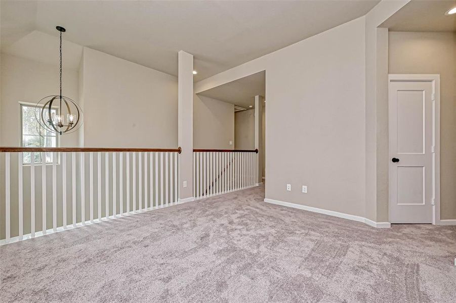 Game room upstairs, feels big with these open stairs