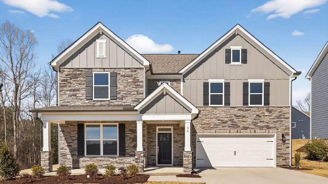 Front exterior of a new home in The Grove at Winston Pointe, Clayton, NC, highlighting curb appeal (Image 1). Front exterior of a new home in The Grove at Winston Pointe, Clayton, NC, highlighting curb appeal (Image 1).