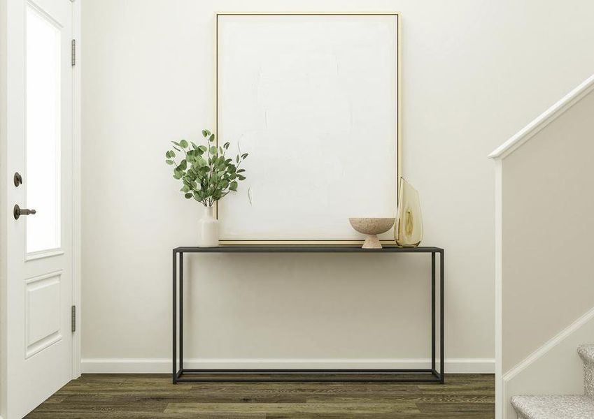 Rendering of the entry hall showcasing
  the 3/4 lite door and vinyl plank flooring. The space is furnished with a
  console table decorated with a potted plant, vase, bowl and large abstract
  painting.