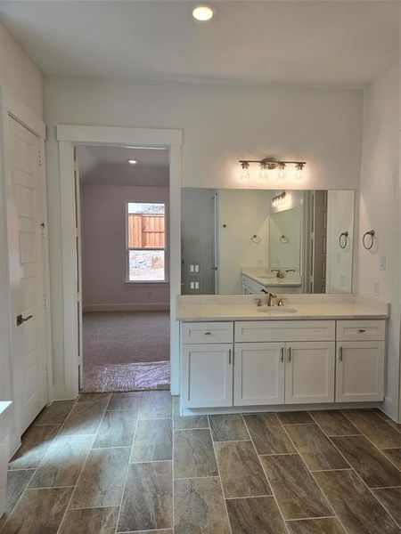 With beautiful flooring and spacious vanities, this owner's bath is calling your name!