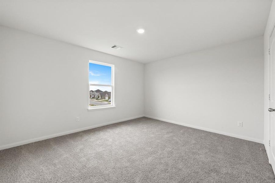 Spare room featuring carpet flooring