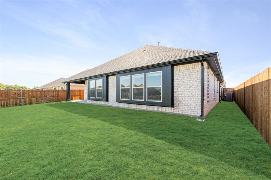 Exterior details and patio area of a home in Timberbrook 3B-4A, Justin (Image 3).