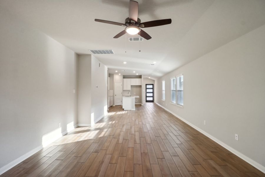 Living and dining room in the Cascade floorplan at a Meritage Homes community.