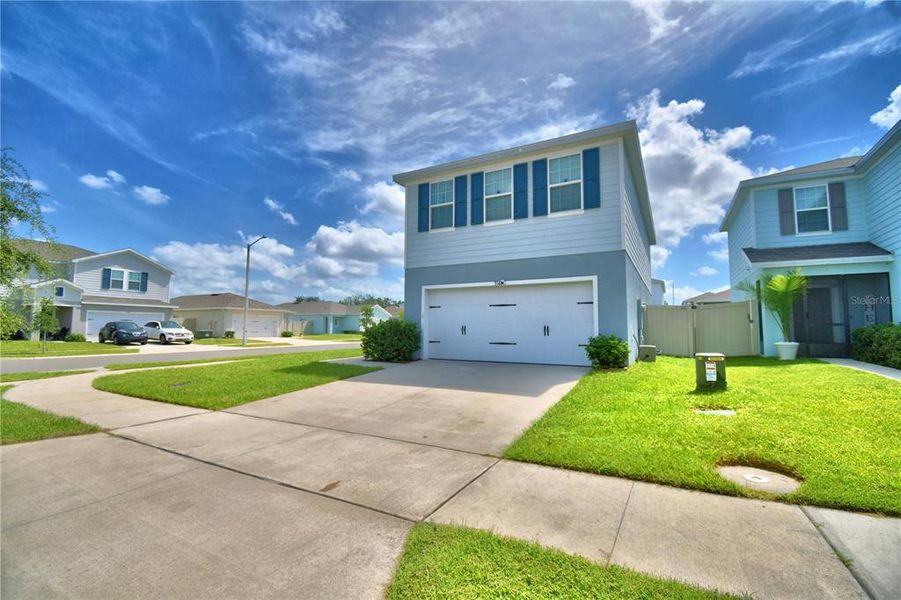 Front exterior of a new home in , Haines City, FL, highlighting curb appeal (Image 22). Front exterior of a new home in , Haines City, FL, highlighting curb appeal (Image 22).