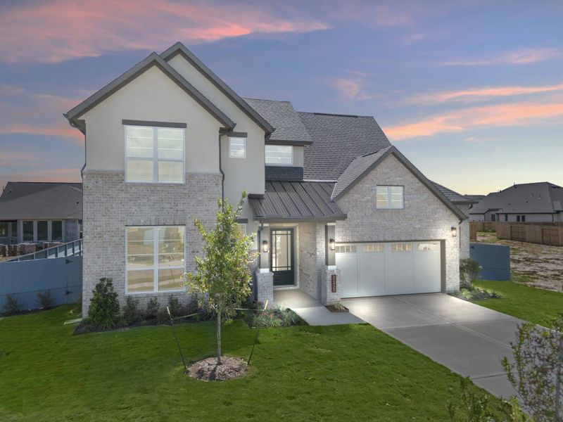 Front exterior of a new home in Fulshear Lakes, Fulshear, TX, highlighting curb appeal (Image 28). Front exterior of a new home in Fulshear Lakes, Fulshear, TX, highlighting curb appeal (Image 28).