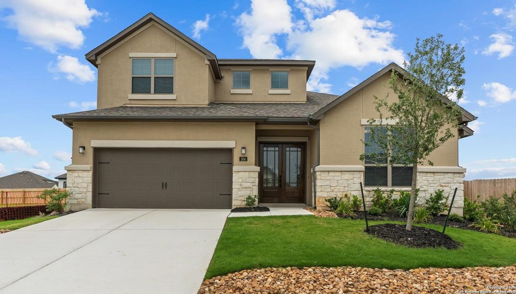Front exterior of a new home in Legacy at Lake Dunlap, New Braunfels, TX, highlighting curb appeal (Image 2).