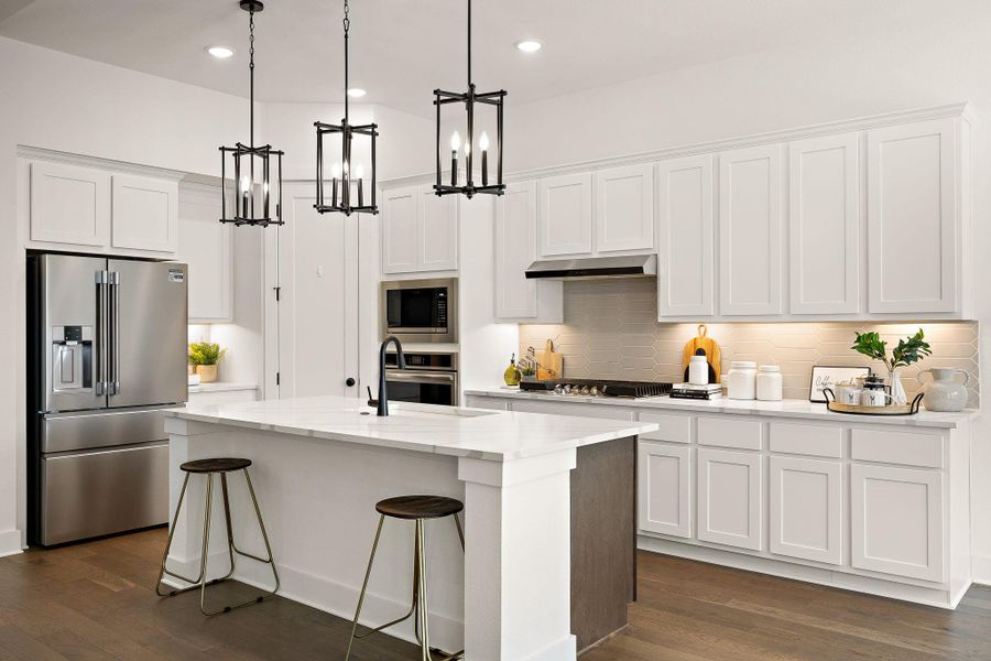 The showstopper is the kitchen with white shaker cabinets, high-end quartz counters & that giant island. The showstopper is the kitchen with white shaker cabinets, high-end quartz counters & that giant island.