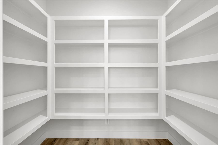 Walk-in pantry and abundant storage make this kitchen as functional as it is beautiful Walk-in pantry and abundant storage make this kitchen as functional as it is beautiful