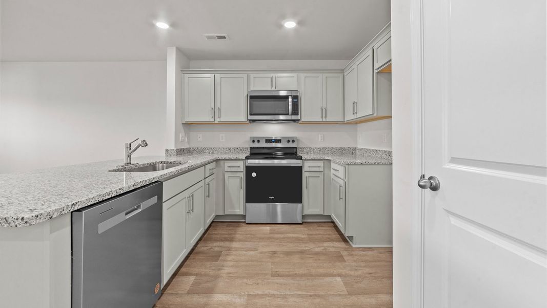 Representative furnished interior of a home built from the Pearson by D.R. Horton in The Townes at Carter Ridge, Greenville (Image 4).