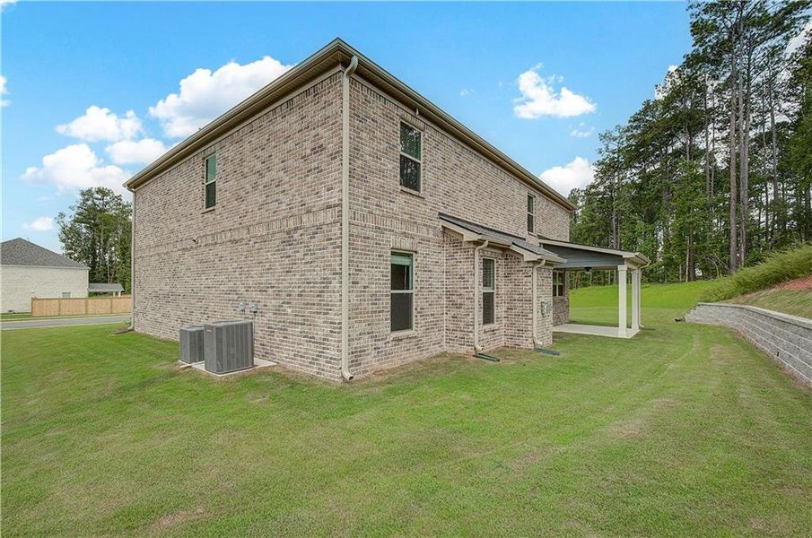 Front exterior of a new home in Trinity Park, McDonough, GA, highlighting curb appeal (Image 16).