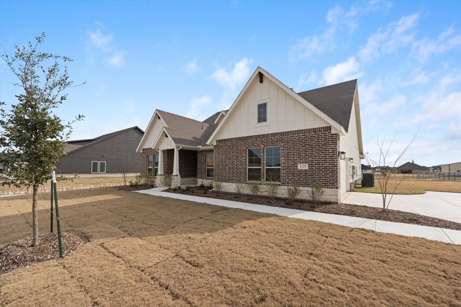 Front exterior of a new home in Fairview Meadows, New Fairview, TX, highlighting curb appeal (Image 24). Front exterior of a new home in Fairview Meadows, New Fairview, TX, highlighting curb appeal (Image 24).