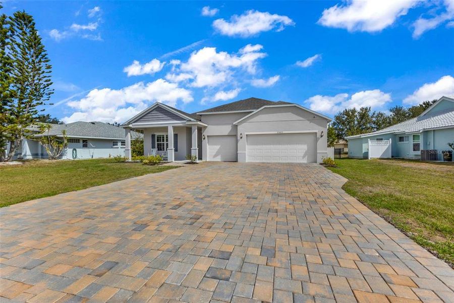 Front exterior of a new home in , Punta Gorda, FL, highlighting curb appeal (Image 27).