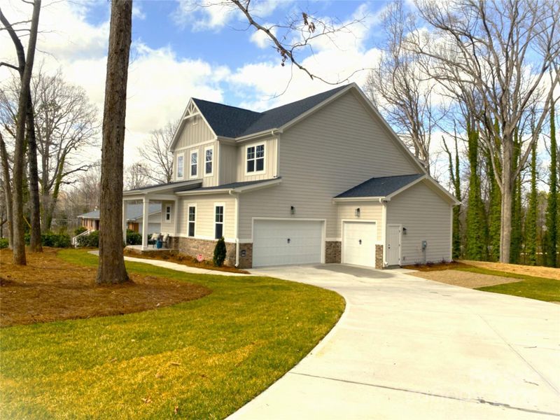 Front exterior of a new home in , Mooresville, NC, highlighting curb appeal (Image 17).