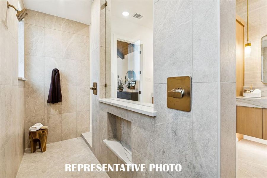 You'll enjoy a spa like experience every day in this sumptuous, double walk through shower.  REPRESENTATIVE PHOTO