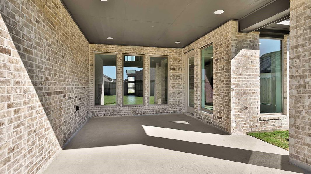 Exterior details and patio area of a home in Candela South 50', Richmond (Image 4).