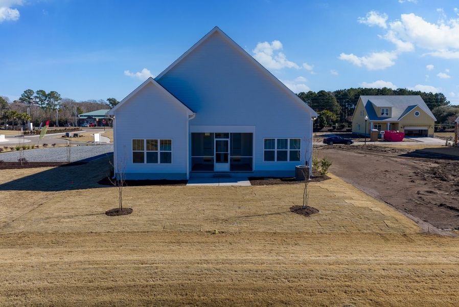 Exterior details and patio area of a home in The Sanctuary at Sunset Beach, Sunset Beach (Image 23).