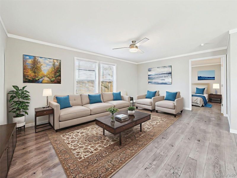 Virtually Staged Family Room – Thoughtfully staged to show the flexibility of the secondary living area, with modern furnishings and effortless flow into the kitchen.