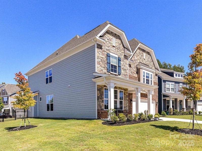 Immaculately Maintained, 4 Bedroom, 3.5 Bath Home with covered front porch, 2 car garage & fenced back yard located in lake access community, Reids Cove!