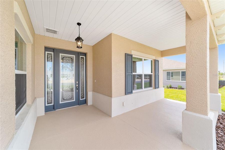 Exterior details and patio area of a home in On Top of the World Communities, Ocala (Image 4).