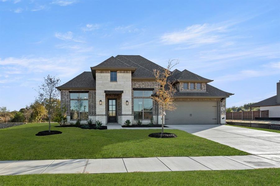 Front exterior of a new home in Mockingbird Hills, Joshua, TX, highlighting curb appeal (Image 1). Front exterior of a new home in Mockingbird Hills, Joshua, TX, highlighting curb appeal (Image 1).