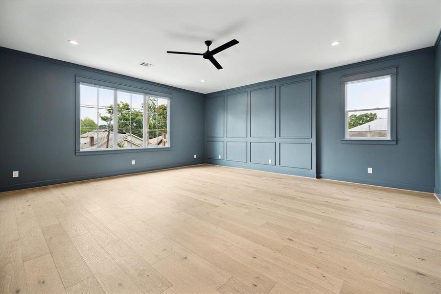 Located on the second floor is an enormous flex space painted a moody blue color. This space is perfect for a media room/gameroom/playroom/gym- the options are endless. The room is so large it can easily function as a multi-use room.