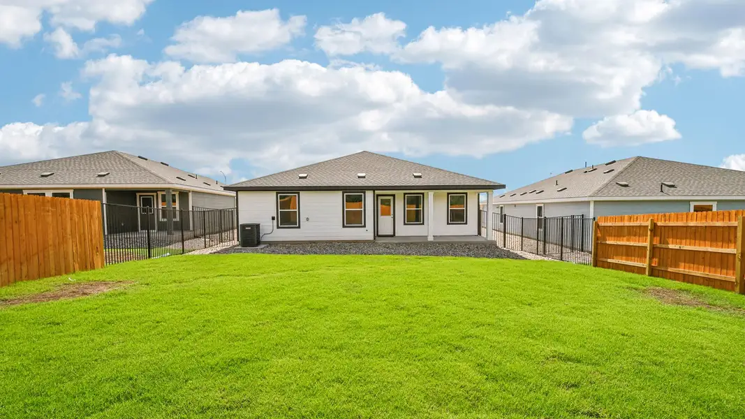 Exterior details and patio area of a home in Trails at Wildhorse, Austin (Image 19).