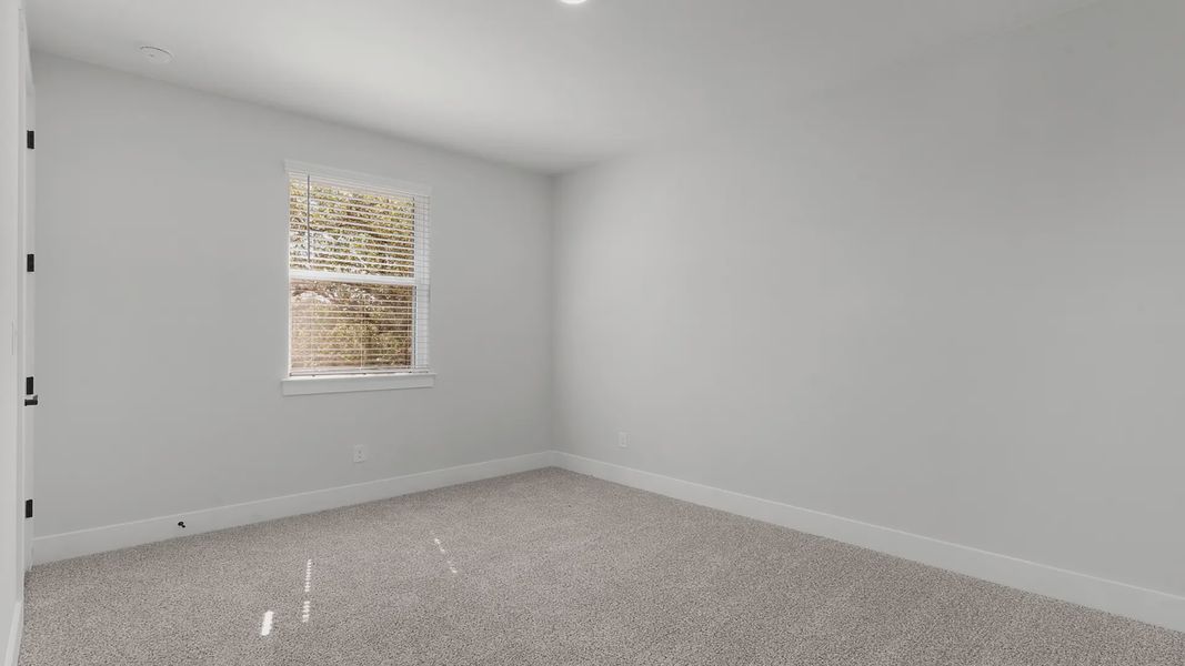 Representative unfurnished interior of a home built from the Mariah by Chesmar Homes in Newhaven, Manor (Image 11).