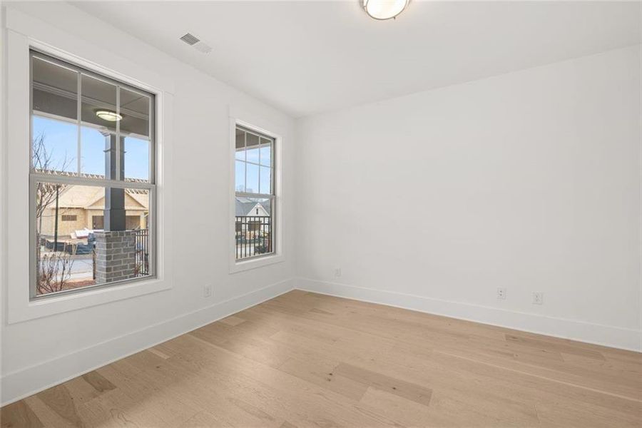 Spacious, unfurnished interior of a new home in Soleil Belmont Park, Canton (Image 45).