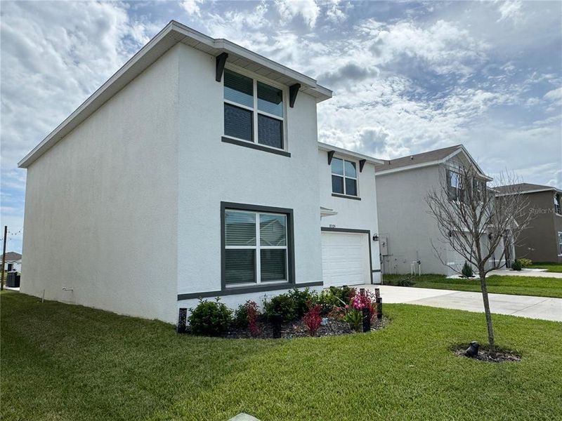 Front exterior of a new home in Zephyr Ridge, Zephyrhills, FL, highlighting curb appeal (Image 20).