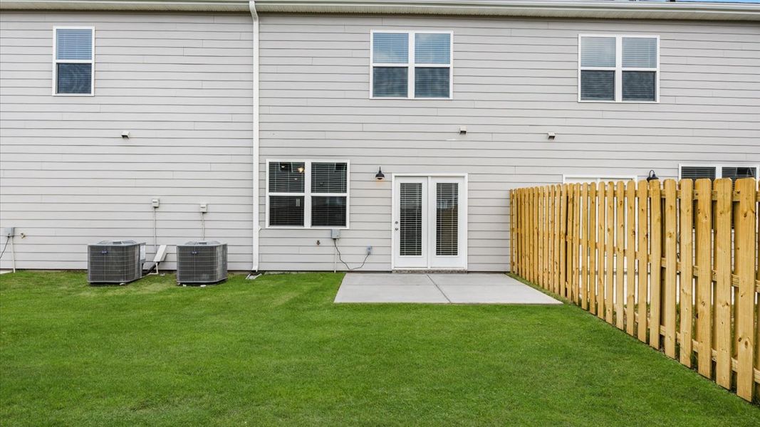 Exterior details and patio area of a home in Laurel Park Townhomes, Hephzibah (Image 4).