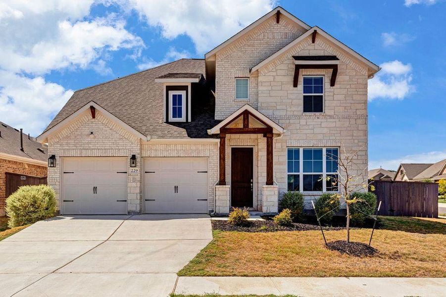 Craftsman inspired home featuring stone siding, concrete driveway, and roof with shingles Craftsman inspired home featuring stone siding, concrete driveway, and roof with shingles